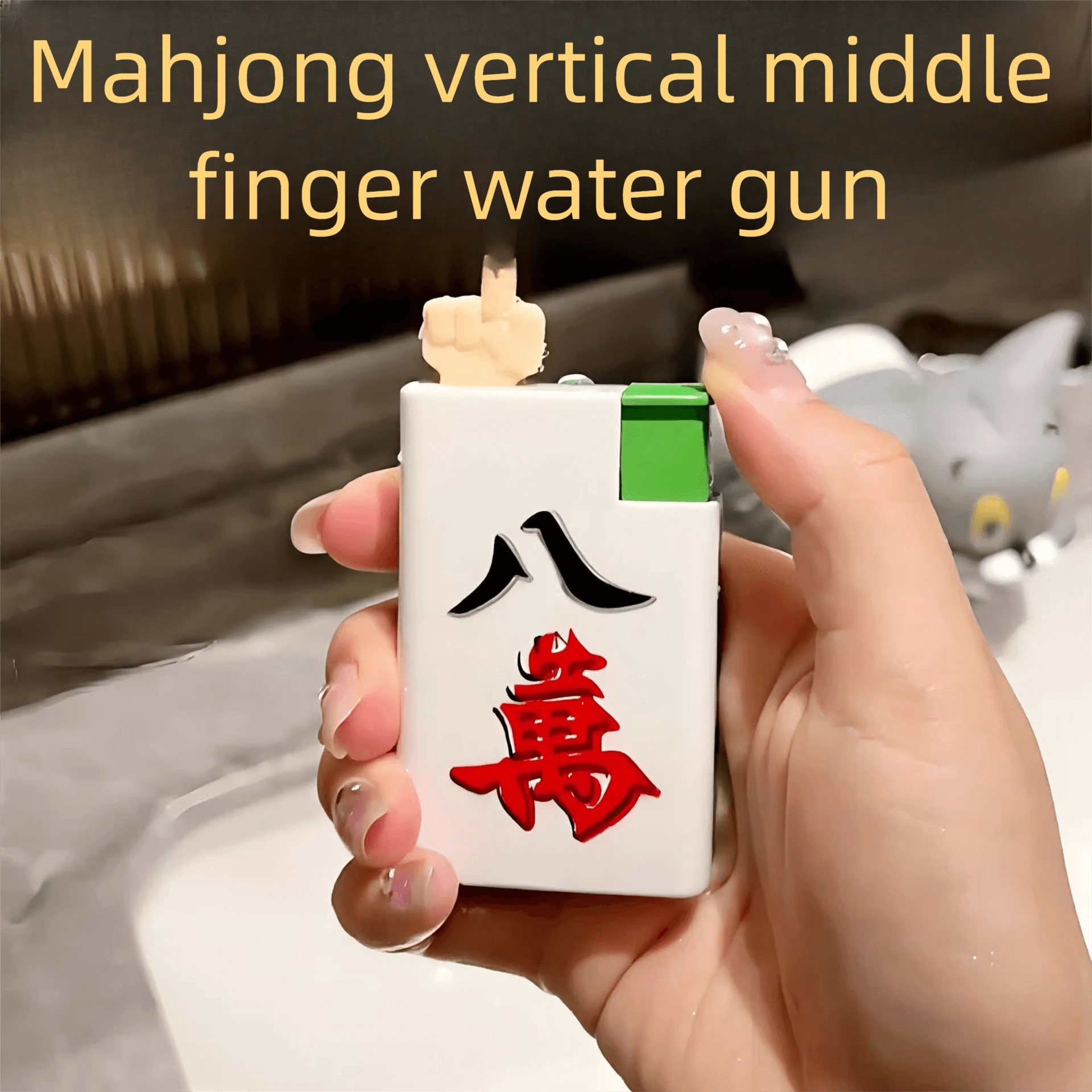 Middle finger water spray prank toy in hand, perfect for funny gag gift and laughter with friends.